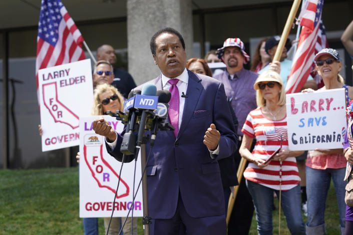 FILE - In this July 13, 2021, file photo radio talk show host Larry Elder speaks to supporters during a campaign stop in Norwalk, Calif. Superior Court Judge Laurie M. Earl ruled Wednesday July 21, that Elder's name should be placed on the ballot for the Sept. 14 recall election aimed at removing Democratic Gov. Gavin Newsom. Judge Earl disagreed with a state decision that Elder failed to meet requirements to qualify to run in the election. (AP Photo/Marcio Jose Sanchez, File)