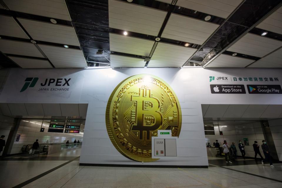 An advert for the unlicensed JPEX crypto platform at a subway station in Hong Kong in 2022.