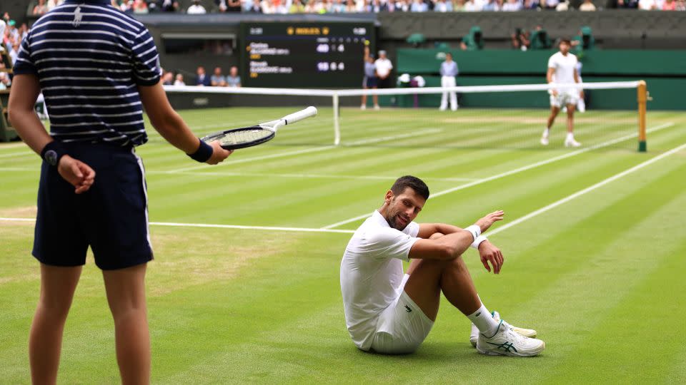 Novak Djokovic reacts after falling. - Clive Brunskill/Getty Images