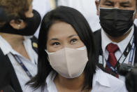 Keiko Fujimori, daughter of imprisoned ex-President Alberto Fujimori and presidential candidate for the Popular Force party, talks to journalists after voting during general elections in Lima, Peru, Sunday, April 11, 2021. Peruvians went to the polls amid a surge in new COVID-19 infections.(AP Photo/Guadalupe Pardo)