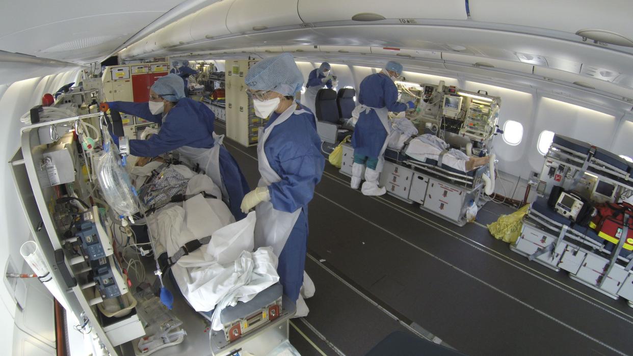 This GoPro image provided Saturday March 28, 2020 by the French Army shows evacuated patients infected with the Covid-19 disease aboard a military plane from Mulhouse, eastern France to Bordeaux, southwestern France, on Friday March 27, 2020.