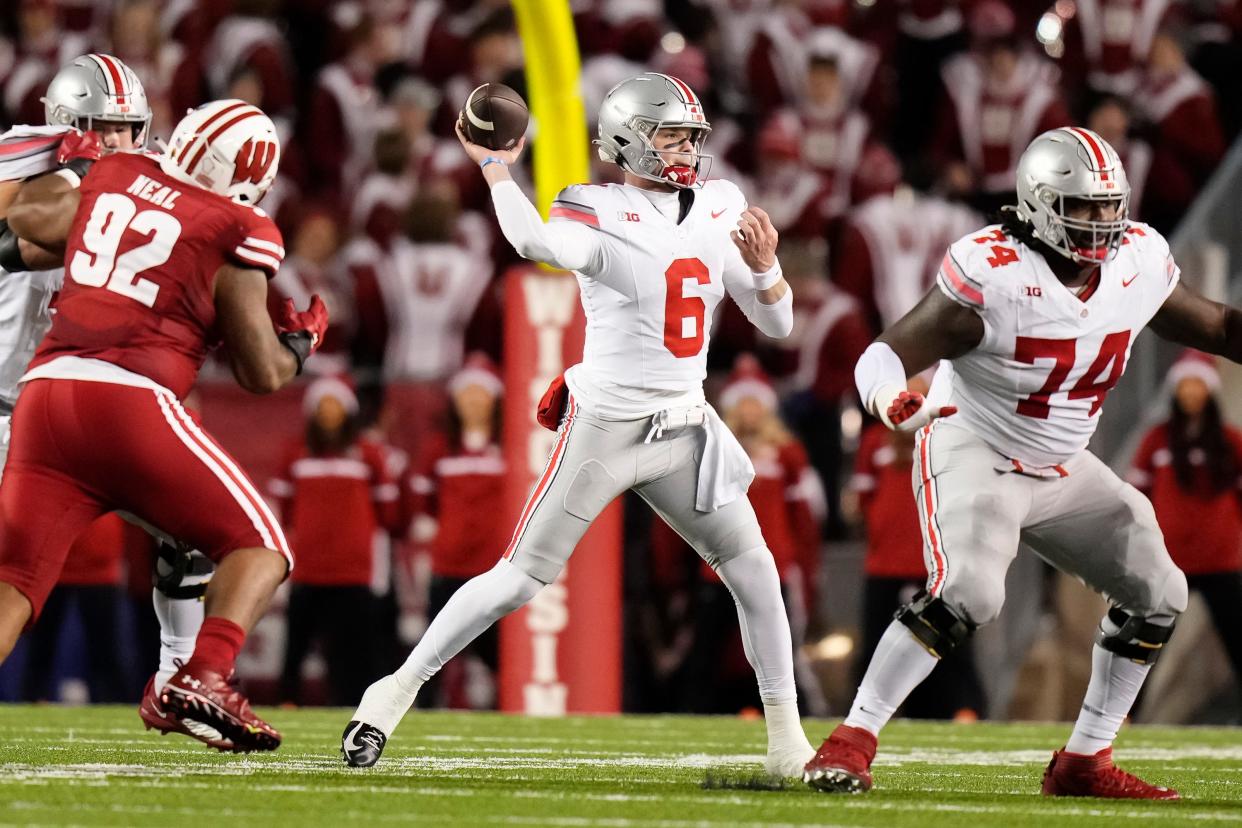 Ohio State quarterback Kyle McCord throws a pass against Wisconsin on Saturday.
