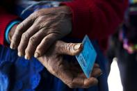 <p>A Quechua indigenous woman holds her identification card before voting during general elections in Iquicha, Peru, April 10, 2016. (Photo: Rodrigo Abd/AP) </p>