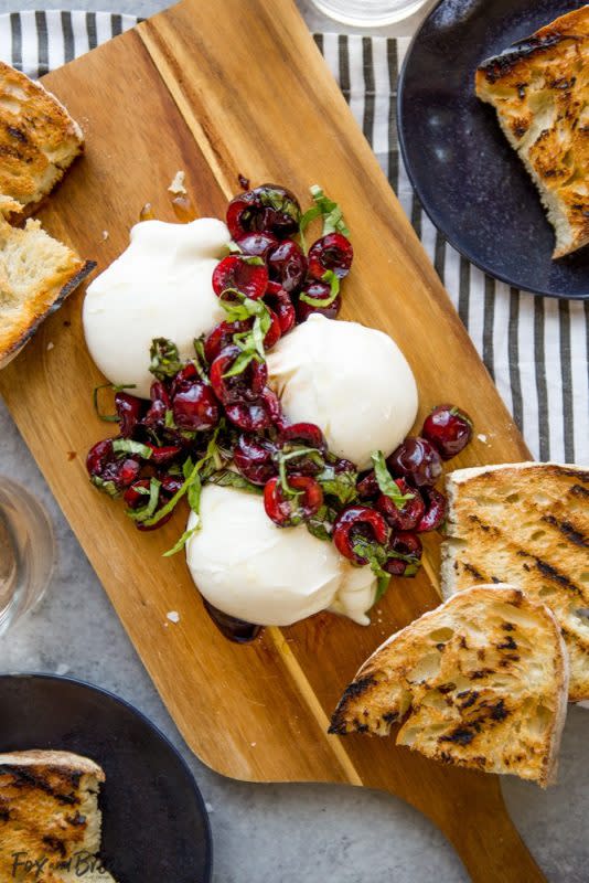 <p>Fox and Briar</p><p>Creamy, fresh burrata paired with juicy cherries and fragrant basil uses summer produce at its best, and no cooking required!</p><p><strong>Get the recipe: <a href="https://www.foxandbriar.com/burrata-balsamic-cherries-basil/" rel="nofollow noopener" target="_blank" data-ylk="slk:Burrata with Balsamic Cherries and Basil;elm:context_link;itc:0;sec:content-canvas" class="link rapid-noclick-resp"><em>Burrata with Balsamic Cherries and Basil</em></a></strong></p>