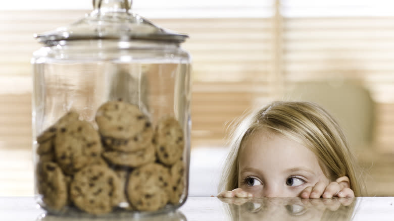 Child looking at cookie jar