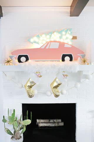 <p><a href="https://abeautifulmess.com/vintage-car-christmas-tree-marquee/" data-component="link" data-source="inlineLink" data-type="externalLink" data-ordinal="1">A Beautiful Mess</a></p>