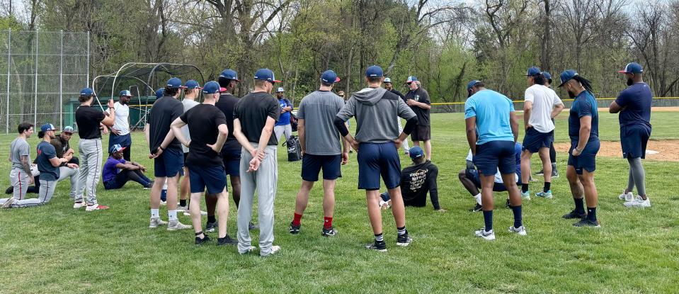 The Hagerstown Flying Boxcars gather around manager Mark Mason at the conclusion of their first practice at Hagerstown Community College on Monday, April 15, 2024.