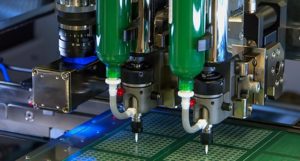 Adhesive-dispensing system working on semiconductor chips.