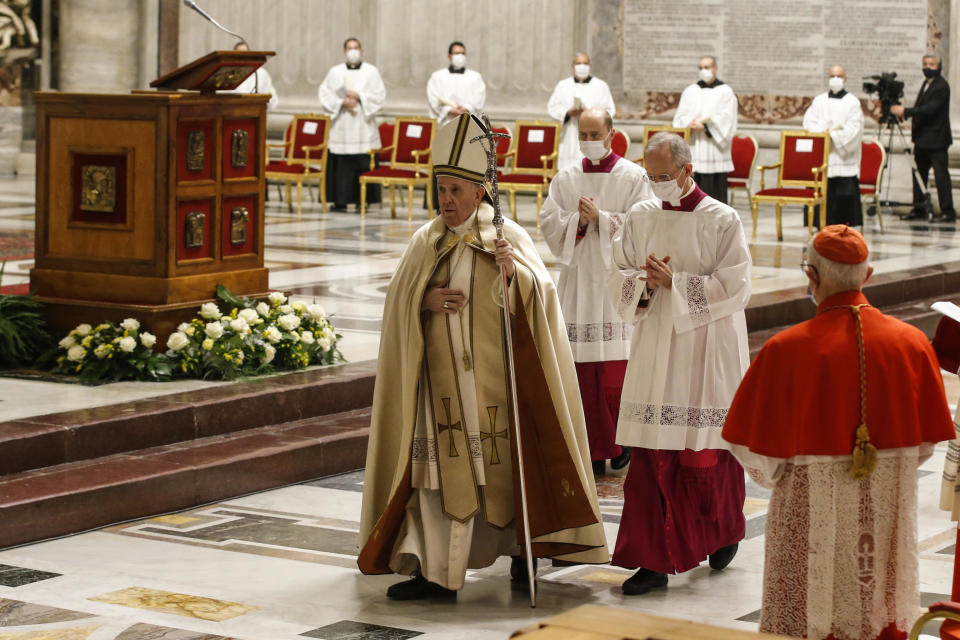 Pope Francis leaves at the end of a consistory ceremony where 13 bishops were elevated to a cardinal's rank in St. Peter’s Basilica at the Vatican, Saturday, Nov. 28, 2020. (Fabio Frustaci/POOL via AP)