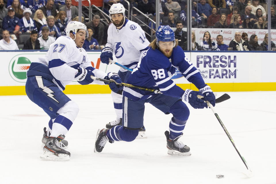 Toronto Maple Leafs right wing William Nylander (88) tangles with Tampa Bay Lightning defenceman Ryan McDonagh (27) during the first period of an NHL hockey game Tuesday, March 10, 2020, in Toronto. (Chris Young/The Canadian Press via AP)