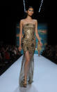 A model walks the runway at the Monique Lhuillier spring 2013 show, Saturday, Sept. 8, 2012, during Fashion Week in New York. (AP Photo/Diane Bondareff)