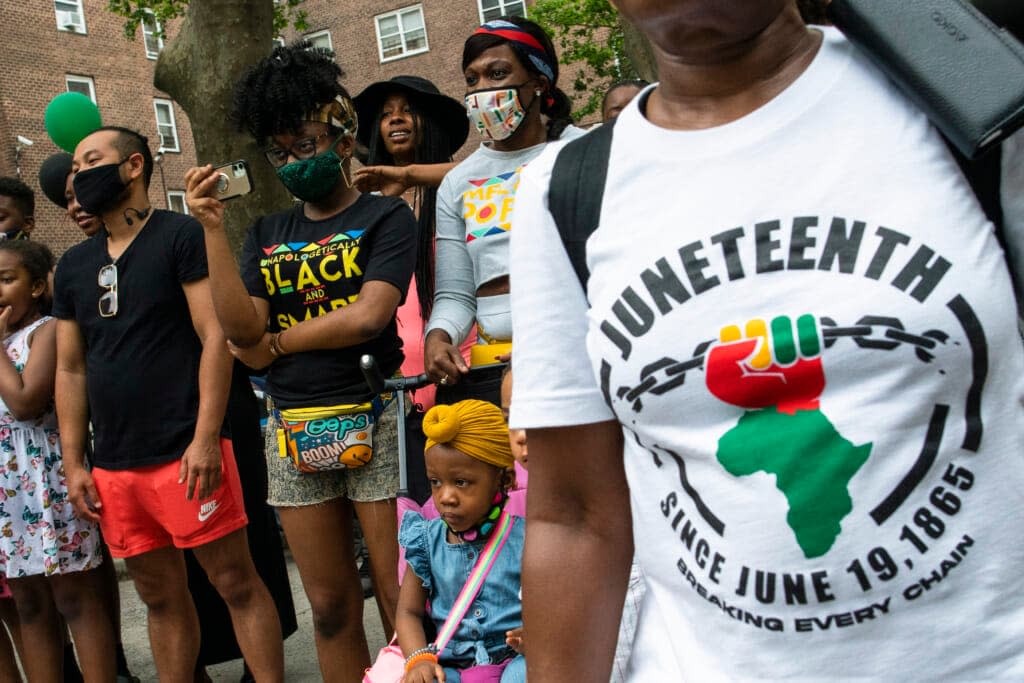 F People attend Juneteenth celebrations in the Harlem neighborhood of New York, on June 19, 2021. Recognition of Juneteenth, the effective end of slavery in the U.S., gained traction after the police killing of George Floyd in 2020. (AP Photo/Eduardo Munoz Alvarez, File)