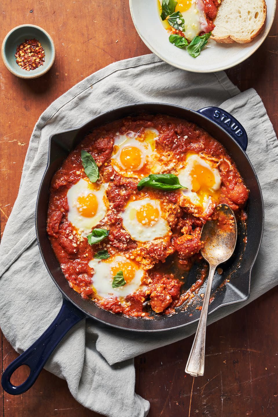 eggs in purgatory, eggs baked into tomato sauce in a skillet