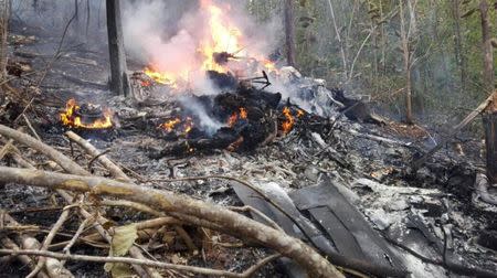 Smoke and fire seen at the site where a plane crashed in the mountainous area of Punta Islita, in the province of Guanacaste, in Costa Rica December 31, 2017 in this picture obtained from social media. Ministerio de Seguridad Publica de Costa Rica/via REUTERS