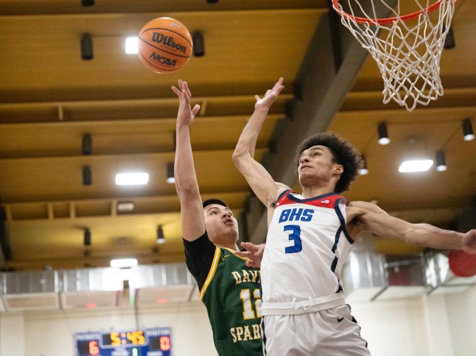 Beyer’s Rodney Oliney blocks the shot of Davis’ John Motta during the Western Athletic Conference game at Beyer High School in Modesto, Calif., Friday, Feb. 2, 2024.