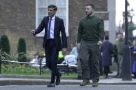 Britain's Prime Minister Rishi Sunak, left, walks with Ukraine's President Volodymyr Zelenskyy at Downing Street in London, Wednesday, Feb. 8, 2023. It is the first visit to the UK by Ukraine's President since Russia's invasion of Ukraine last year. (AP Photo/Kin Cheung)