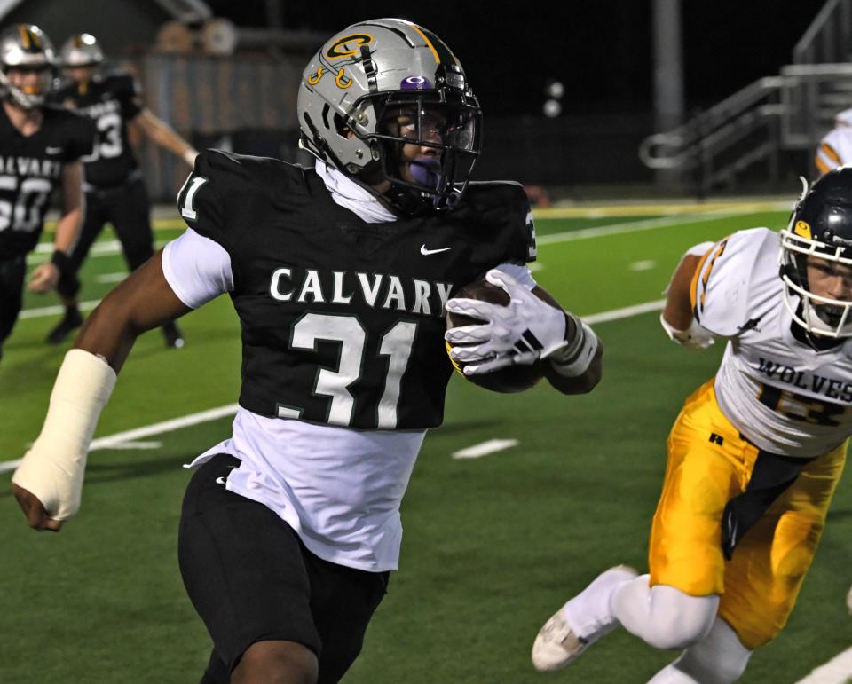 Calvary's James Simon moves the ball against D'Arbonne Woods Friday 10-20-23.