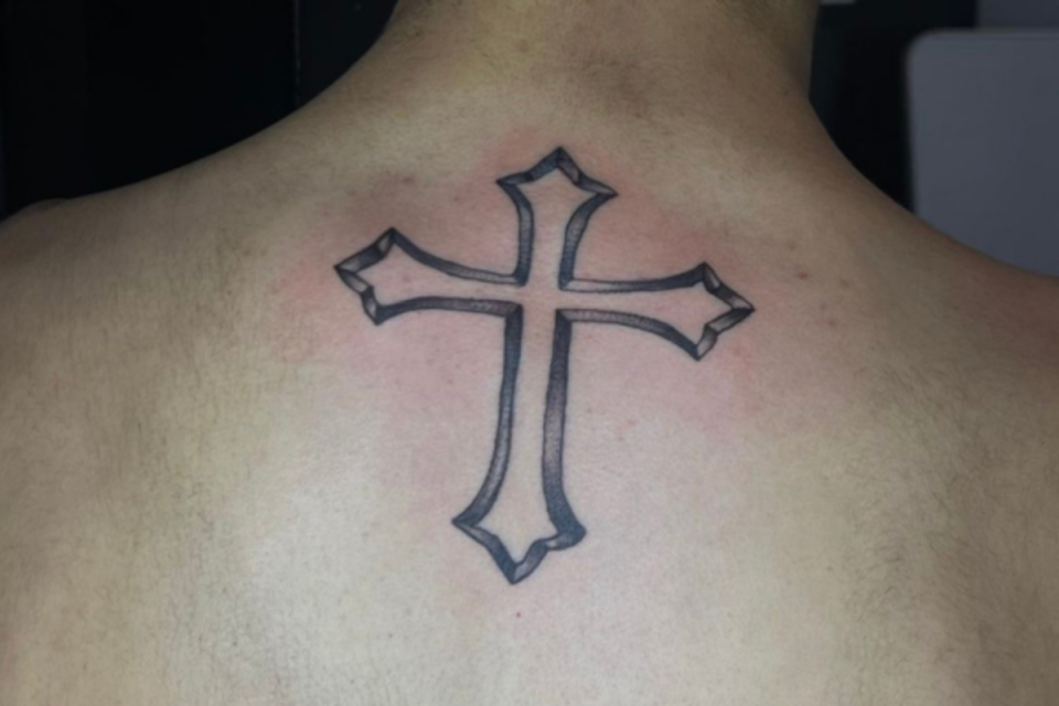 Center back cross tattoo <p>Micheal Backleh</p>