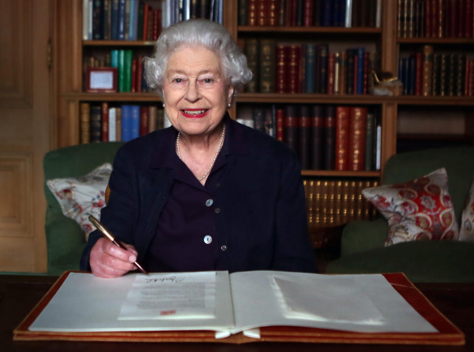 The Queen sitting at her desk in Balmoral in 2013. [Photo: PA]