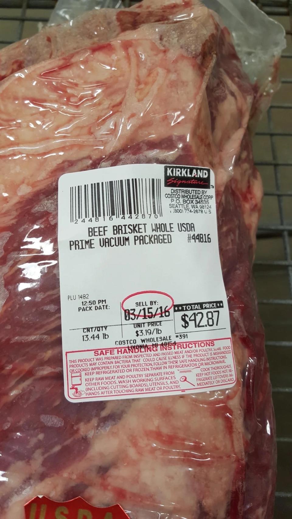 Packaged Kirkland beef brisket with price and sell-by date label, indicating it's USDA choice