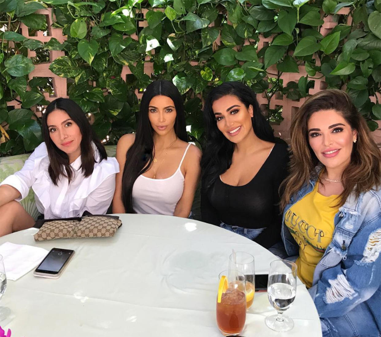 Beauty moguls Kim Kardashian and Huda Kattan, center, flanked by celebrity hairstylist Jen Atkin, far left, and vice president of Huda Beauty, Moda Kattan, far right. (Photo: hudabeauty/Instagram)