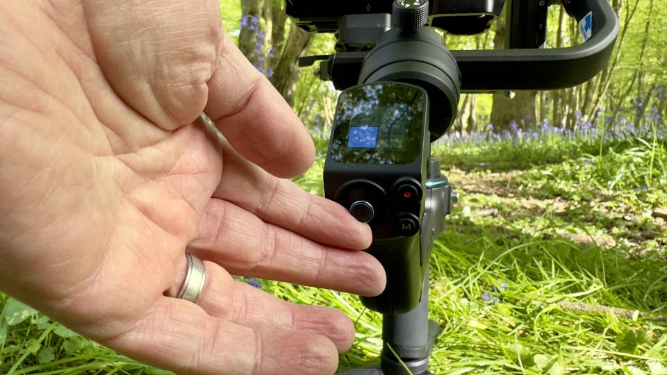 Close up of a hand using a FeiyuTech Scorp 2 gimbal