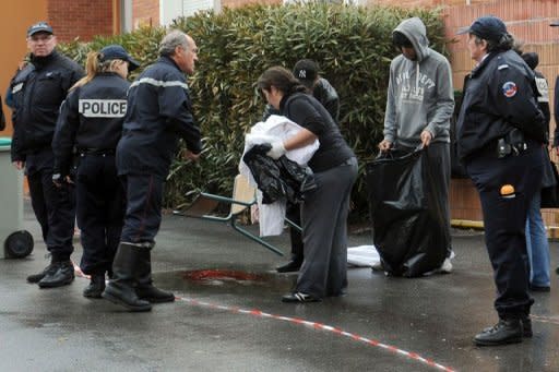 Officers work near the "Ozar Hatorah" Jewish school in Toulouse, southwestern France, where four people, including three children, were shot dead