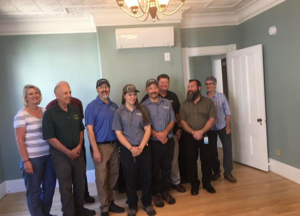 The weatherization team from Community Action Partnership of Strafford County, who did work at Abi's Place