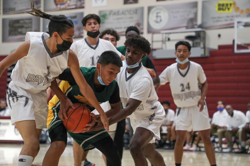 The Rancho Mirage swarms a Palo Verde player, November 23, 2021.