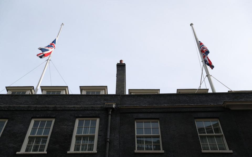 Flags are flown at half mast in Downing Street - Credit: Andrew Matthews/PA Wire