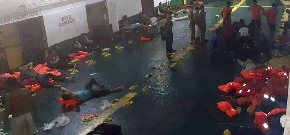 In this photo provided by Philippine Coast Guard in Manila, rescued passengers of the ill-fated M/V Lite Ferry 16, are attended to by the coast guard rescuers and crew of responding vessels, on a ferry which responded to the incident, following an overnight ferry fire Wednesday, Aug. 28, 2019, off Dapitan city in Zamboanga del Norte province in southern Philippines. (Philippine Coast Guard via AP)