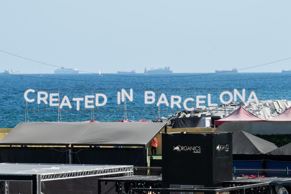 The "Created In Barcelona" sign sits in front of the sea with ships in the distance during Primavera Sound 2022.