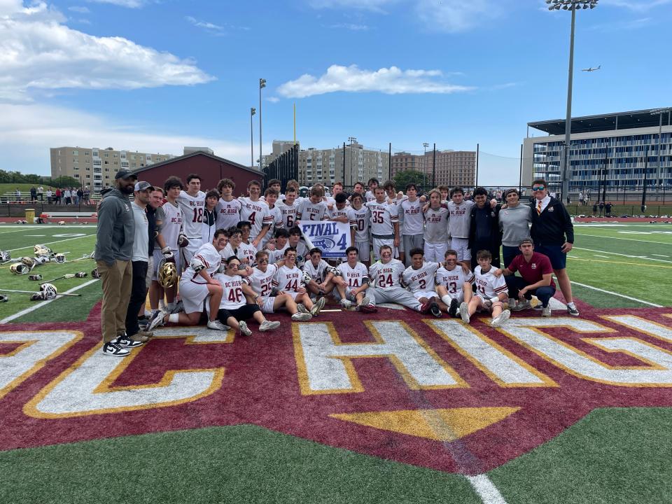 The BC High boys lacrosse poses with the Final Four banner after defeated Xaverian, 14-5, in the Division 1 quarterfinals on Saturday, June 10, 2023.