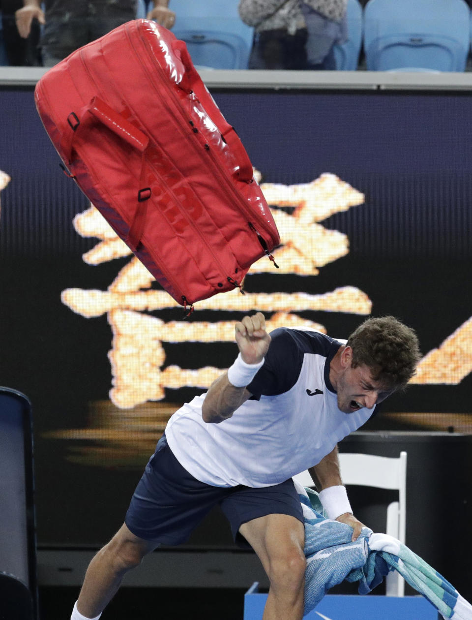 Spain's Pablo Carreno Busta reacts in frustration after losing his fourth round match to Japan's Kei Nishikori at the Australian Open tennis championships in Melbourne, Australia, Monday, Jan. 21, 2019. (AP Photo/Aaron Favila)