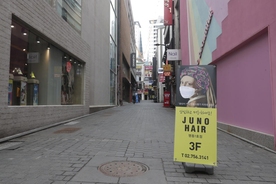 An advertisement of a hair shop is seen at a shopping district in Seoul, South Korea, Thursday, March 4, 2021. South Korea's central bank says the country's economy shrank for the first time in 22 years in 2020 as the coronavirus pandemic destroyed service industry jobs and depressed consumer spending. (AP Photo/Ahn Young-joon)