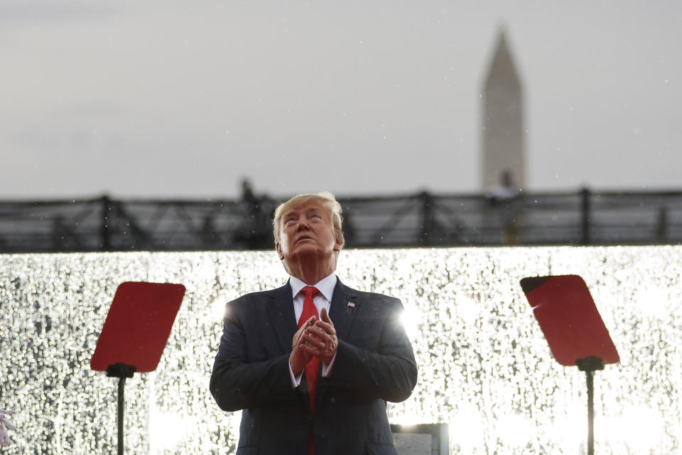 President Trump looks up during military flyovers at his Independence Day celebration in front of the Lincoln Memorial in Washington, D.C., on Thursday. (AP Photo/Carolyn Kaster)