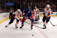 NEW YORK, NY - MAY 12: Brian Boyle #22 of the New York Rangers fights for the puck in the corner in the secon dperiod against Jeff Halpern #15 and Nicklas Backstrom #19 of the Washington Capitals in Game Seven of the Eastern Conference Semifinals during the 2012 NHL Stanley Cup Playoffs at Madison Square Garden on May 12, 2012 in New York City. (Photo by Paul Bereswill/Getty Images)