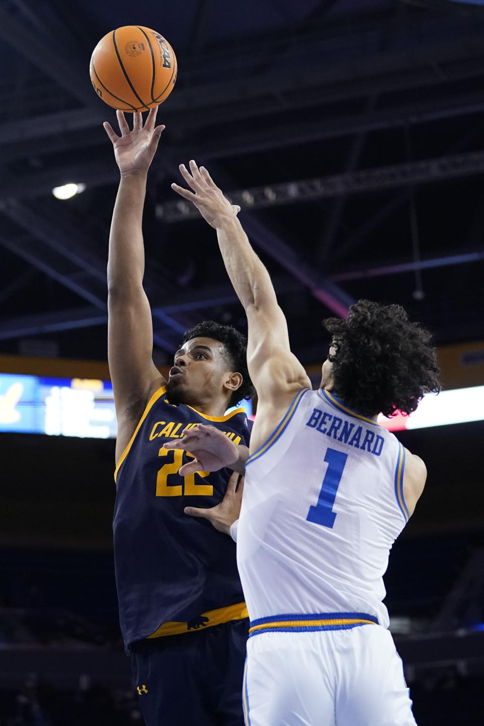 California forward Andre Kelly (22) shoots against UCLA guard Jules Bernard (1) during the first half of an NCAA college basketball game in Los Angeles, Thursday, Jan. 27, 2022. (AP Photo/Ashley Landis)