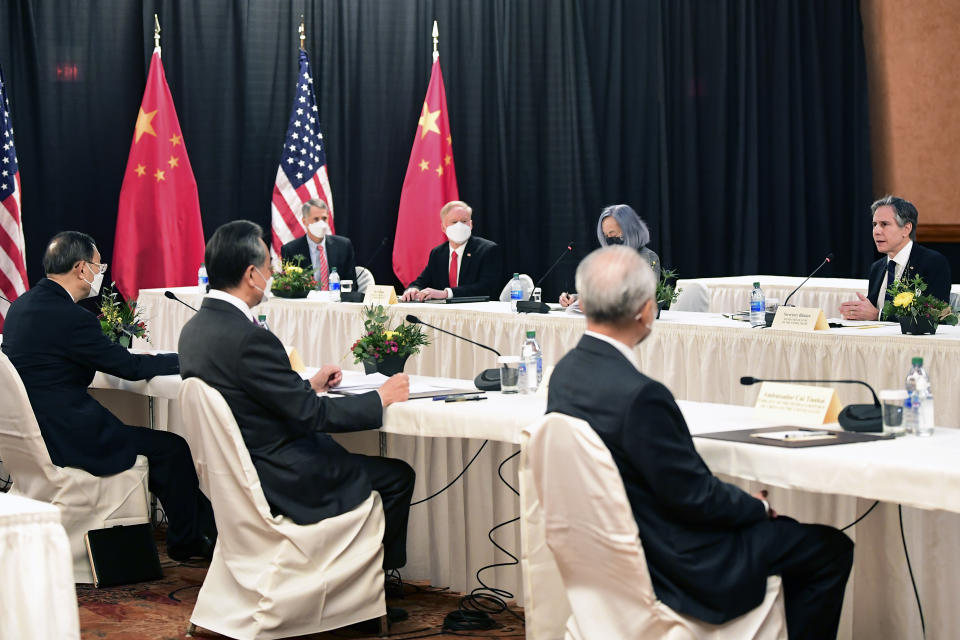 Secretary of State Antony Blinken, far right, speaks as Chinese Communist Party foreign affairs chief Yang Jiechi, left, and China's State Councilor Wang Yi, second from left, listen at the opening session of US-China talks at the Captain Cook Hotel in Anchorage, Alaska, Thursday, March 18, 2021. (Frederic J. Brown/Pool via AP)