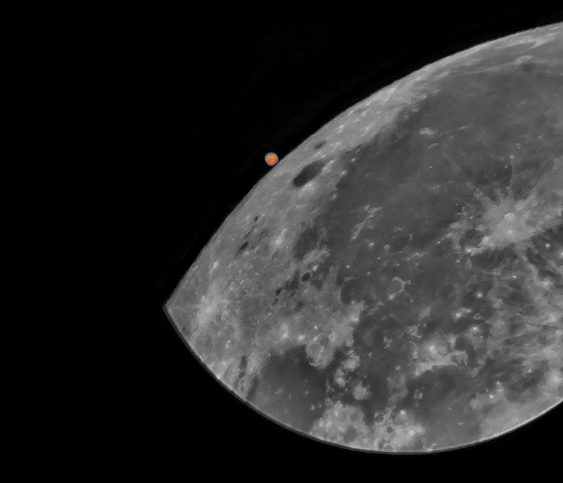 Mars is seen beyond the Moon in this shot just before it passes behind our satellite.