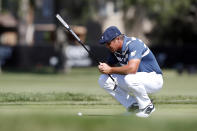 Bryson DeChambeau studies his putt on the 13th green during the final round of the Rocket Mortgage Classic golf tournament, Sunday, July 5, 2020, at Detroit Golf Club in Detroit. (AP Photo/Carlos Osorio)