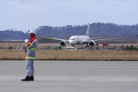 A plane arrives before Olympic Flame Arrival Ceremony at Japan Air Self-Defense Force Matsushima Base in Higashimatsushima in Miyagi Prefecture, north of Tokyo, Friday, March 20, 2020. The Olympic flame from Greece is set to arrive in Japan even as the opening of the the Tokyo Games in four months is in doubt with more voices suggesting the games should to be postponed or canceled because of the worldwide virus pandemic. (AP Photo/Eugene Hoshiko)