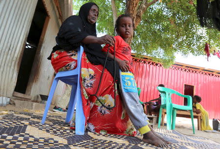 Faduma Farah Guled and her daughter Micraaj Mohamed reacts as she waits for information about her son Mohamed Farah, who is missing in the Mediterranean Sea following the recent shipwreck at an unknown location between Libya and Italy, during a Reuters interview at their home in Somalia's capital Mogadishu, April 22, 2016. REUTERS/Feisal Omar