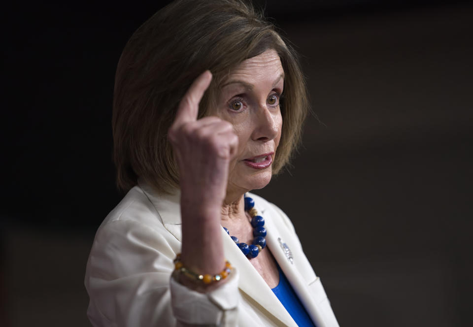 Speaker of the House Nancy Pelosi, D-Calif., talks to reporters as the House Intelligence Committee holds public impeachment hearings of President Donald Trump's efforts to tie U.S. aid for Ukraine to investigations of his political opponents. Pelosi says there is clear evidence that President Donald Trump has used his office for his personal gain. She says doing that "undermined the national security of the United States." (AP Photo/J. Scott Applewhite)