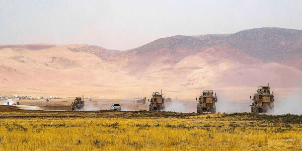 PHOTO: US Oshkosh M-ATV Mine Resistant Ambush Protected (MRAP) military vehicles drive during a patrol near the Syrian-Turkish border in one of the villages that was bombarded the previous week in Syria's northeastern Hasakah province, on Aug. 21, 2022.   (Delil Souleiman/AFP via Getty Images)