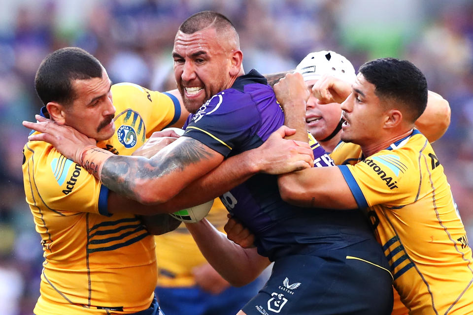 The Storm's Nelson Asofa-Solomona (pictured middle) is tackled during the round three NRL match against the Parramatta Eels.