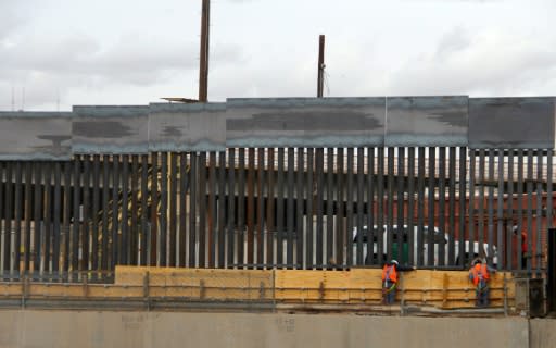 US workers build the border wall between El Paso, Texas, US and Ciudad Juarez, Mexico on February 5, 2019