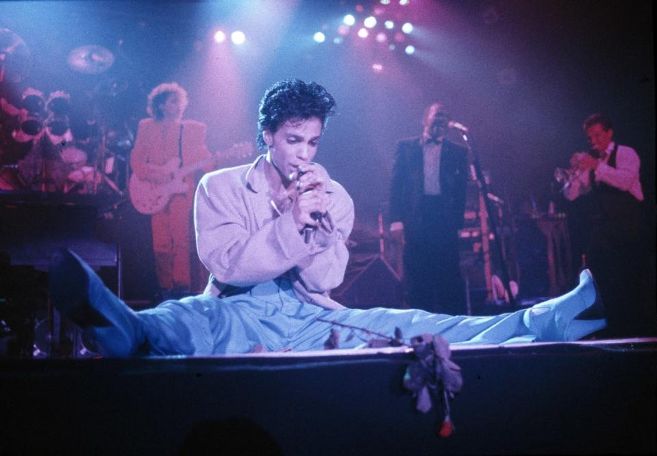 <div class="inline-image__caption"><p>Prince performs on stage on the Hit N Run-Parade Tour, Wembley Arena, London, August 1986.</p></div> <div class="inline-image__credit">Michael Putland/Getty</div>