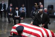 <p>Lewis's only child, John-Miles Lewis, laid his hand on his father's casket. John-Miles's father was widely known as the "conscience of the U.S. Congress."</p>