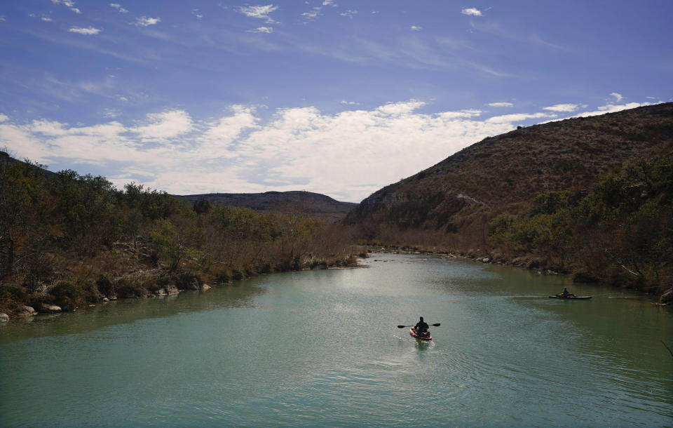 FILE - A paddler floats along the Devil's River on Feb. 17, 2023, near Del Rio, Texas. Congress on Wednesday, March 29, 2023, approved a resolution to overturn the Biden administration’s protections for the nation’s waterways that Republicans have criticized as a burden on business, advancing a measure that President Joe Biden has promised to veto. (AP Photo/Eric Gay, File)